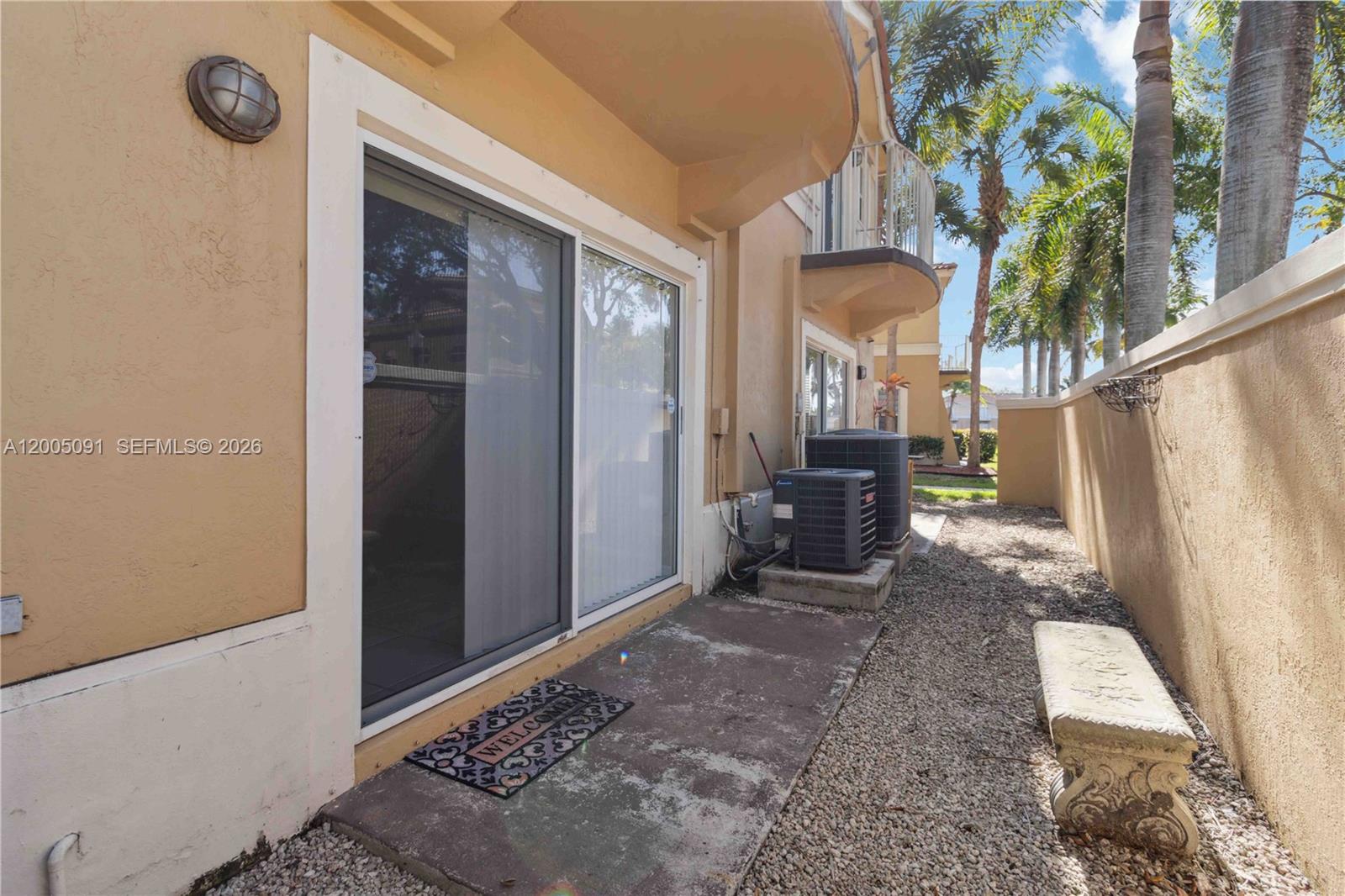 3079 Southwest 129th Way, Unit 159 Miramar, FL 33027 - Photo 33 of 44 a view of a house with a patio