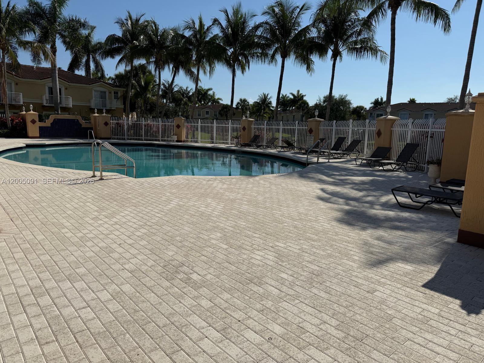 3079 Southwest 129th Way, Unit 159 Miramar, FL 33027 - Photo 42 of 44 a view of outdoor space with swimming pool