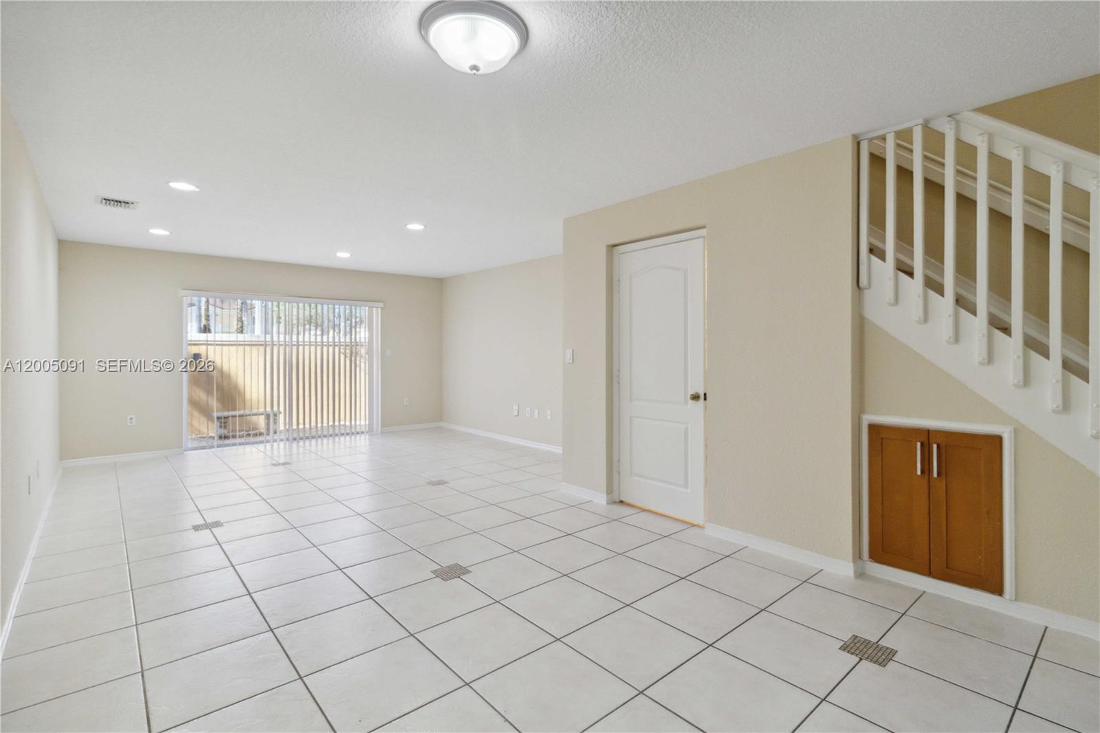 3079 Southwest 129th Way, Unit 159 Miramar, FL 33027 - Photo 9 of 44 a view of an empty room and window