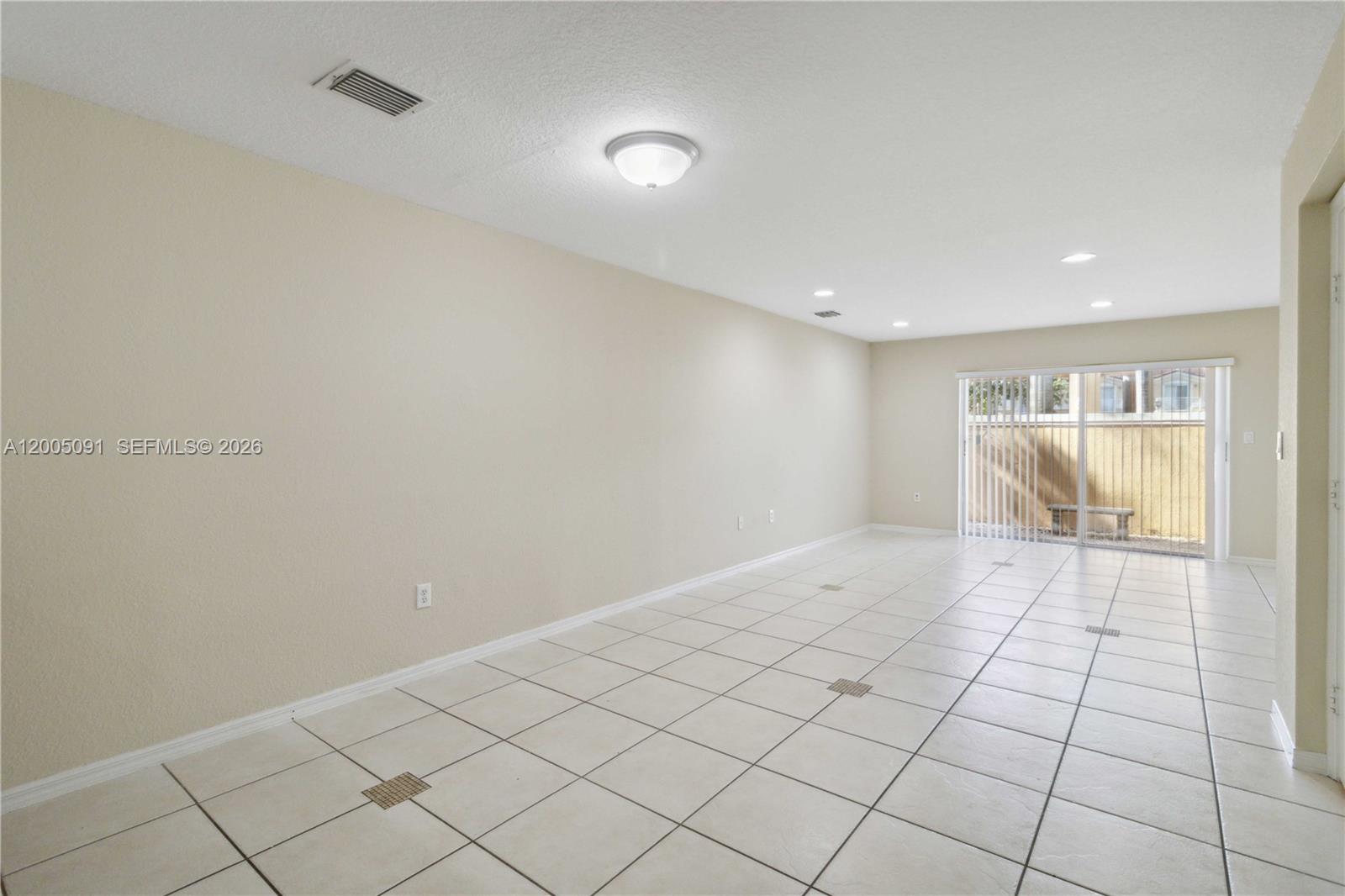 3079 Southwest 129th Way, Unit 159 Miramar, FL 33027 - Photo 10 of 44 a view of an empty room and window