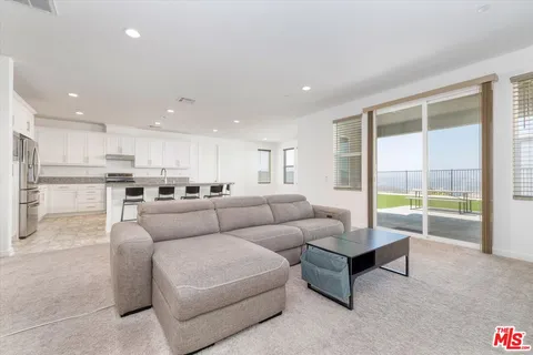 a view of a workspace with furniture