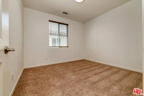 a front view of a house with garden and porch