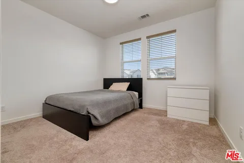 a house view with swimming pool in front of it