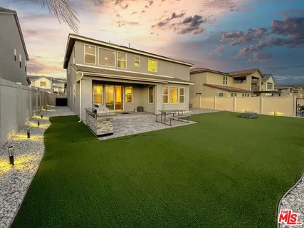 a view of a big yard with palm trees