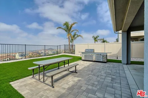 a view of a town with mountains in the background