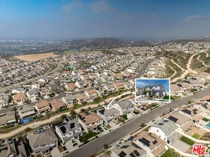 a living room with fireplace furniture and a fireplace
