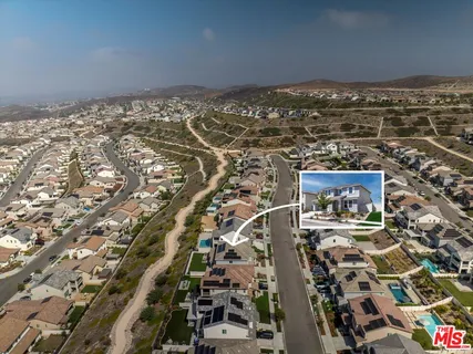 a view of a backyard with swimming pool