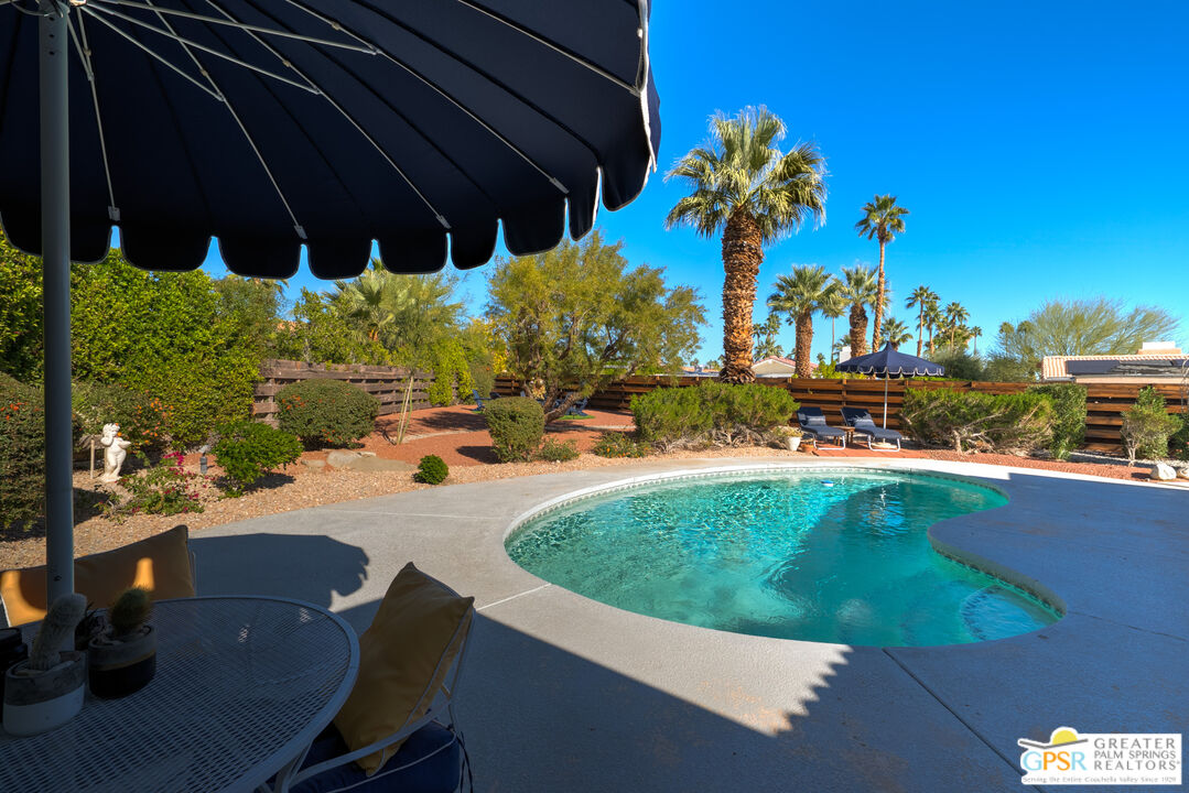566 North Sunset Way Palm Springs, CA 92262 - Photo 28 of 39 a view of a swimming pool with a patio