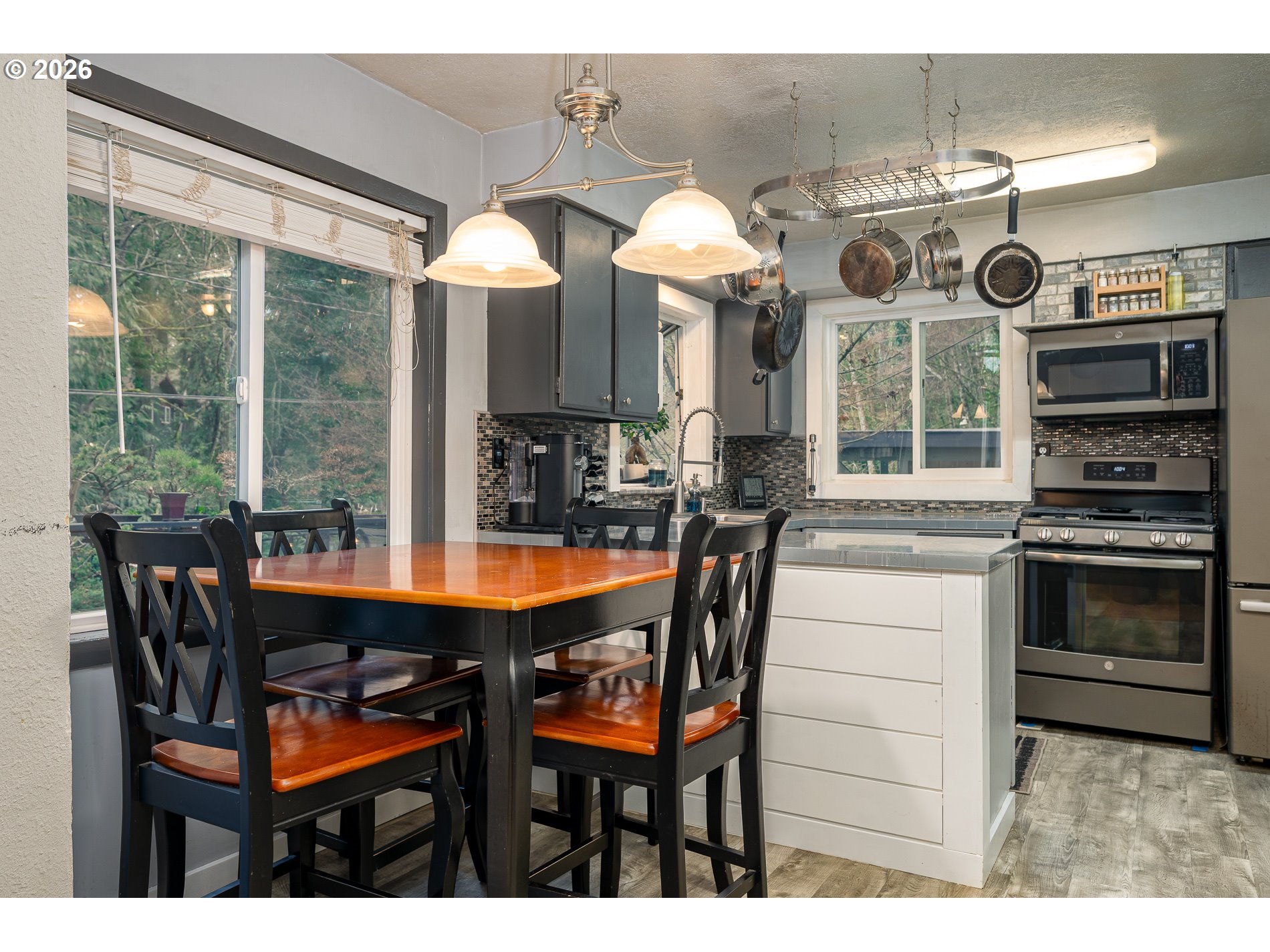 2685 Southwest 89th Avenue Portland, OR 97225 - Photo 14 of 37 a view of a dining room with furniture window and outside view