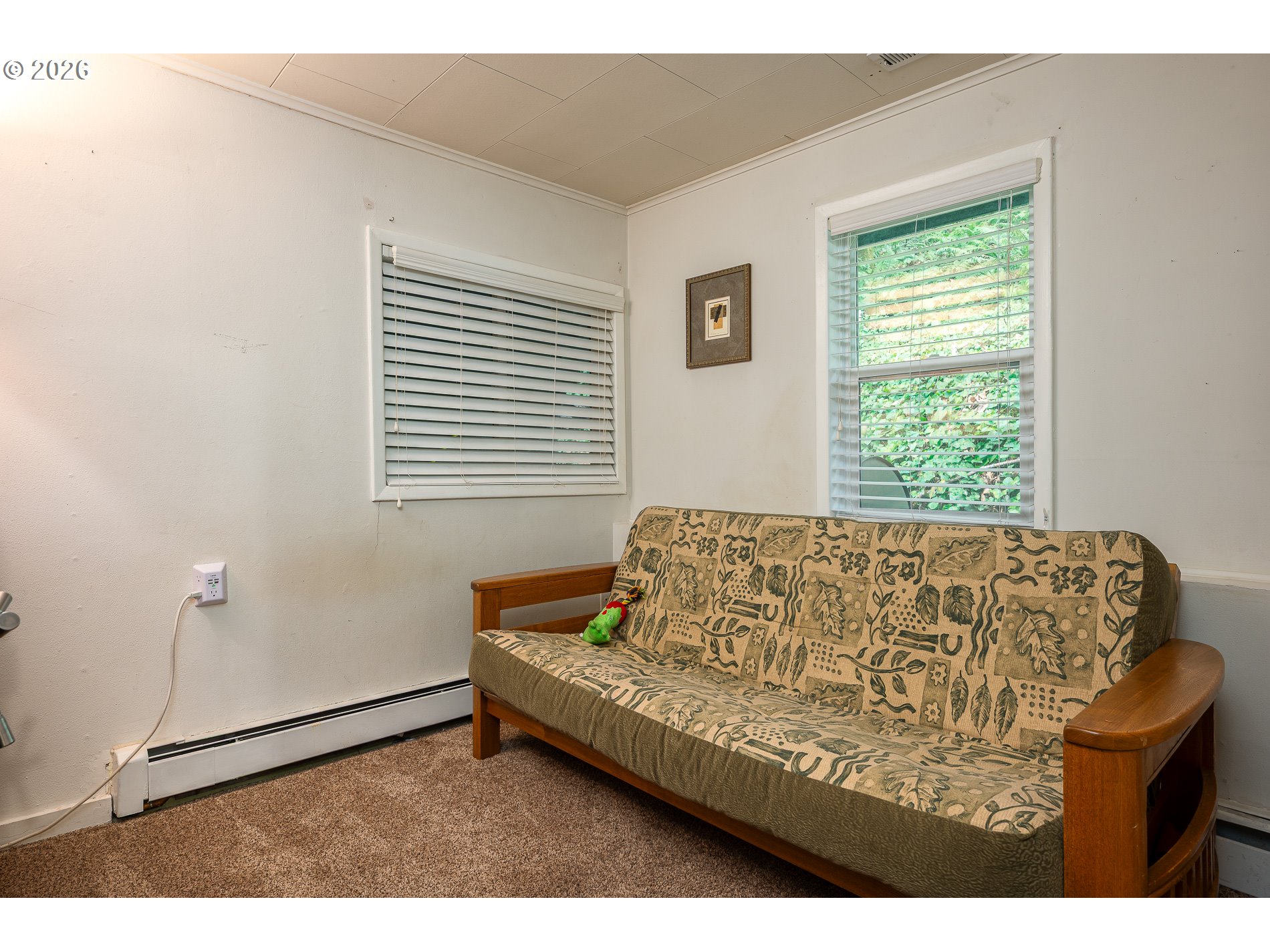 2685 Southwest 89th Avenue Portland, OR 97225 - Photo 26 of 37 a bed sitting in a bedroom next to a window