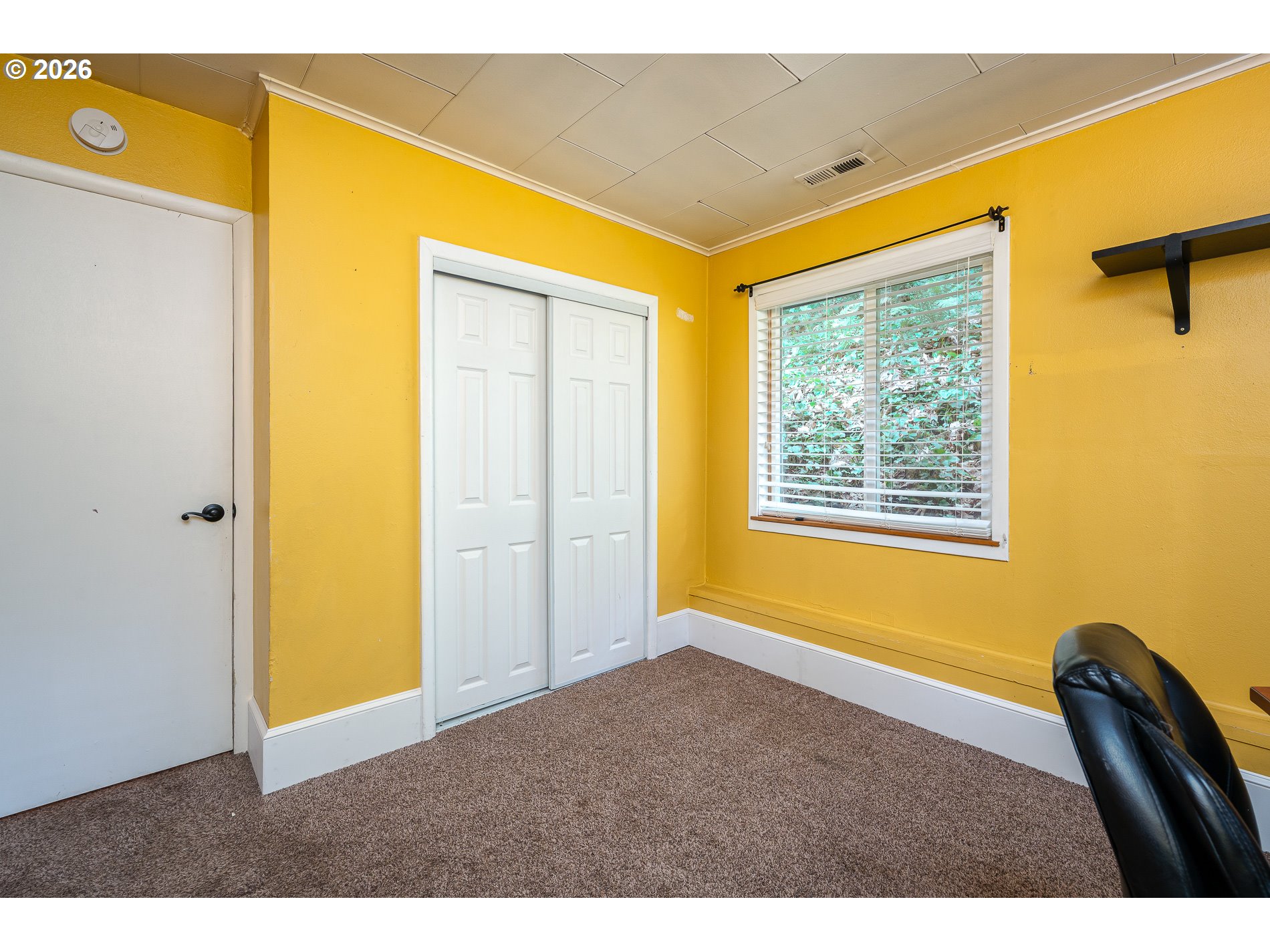 2685 Southwest 89th Avenue Portland, OR 97225 - Photo 28 of 37 a view of an empty room with window and a kitchen