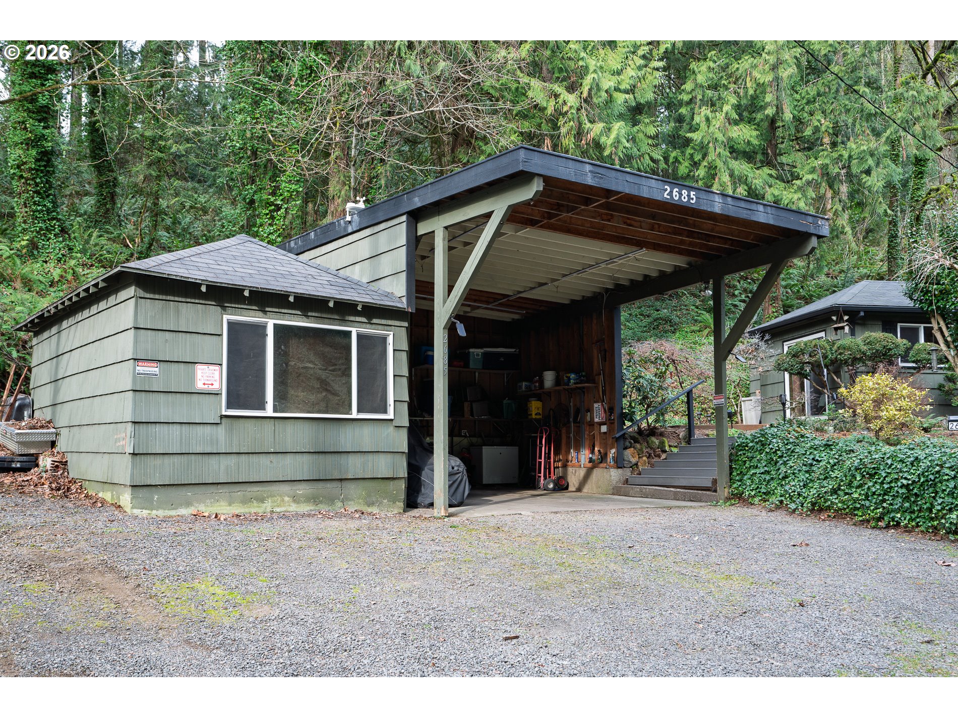 2685 Southwest 89th Avenue Portland, OR 97225 - Photo 31 of 37 a view of barn with a table and chairs under an umbrella