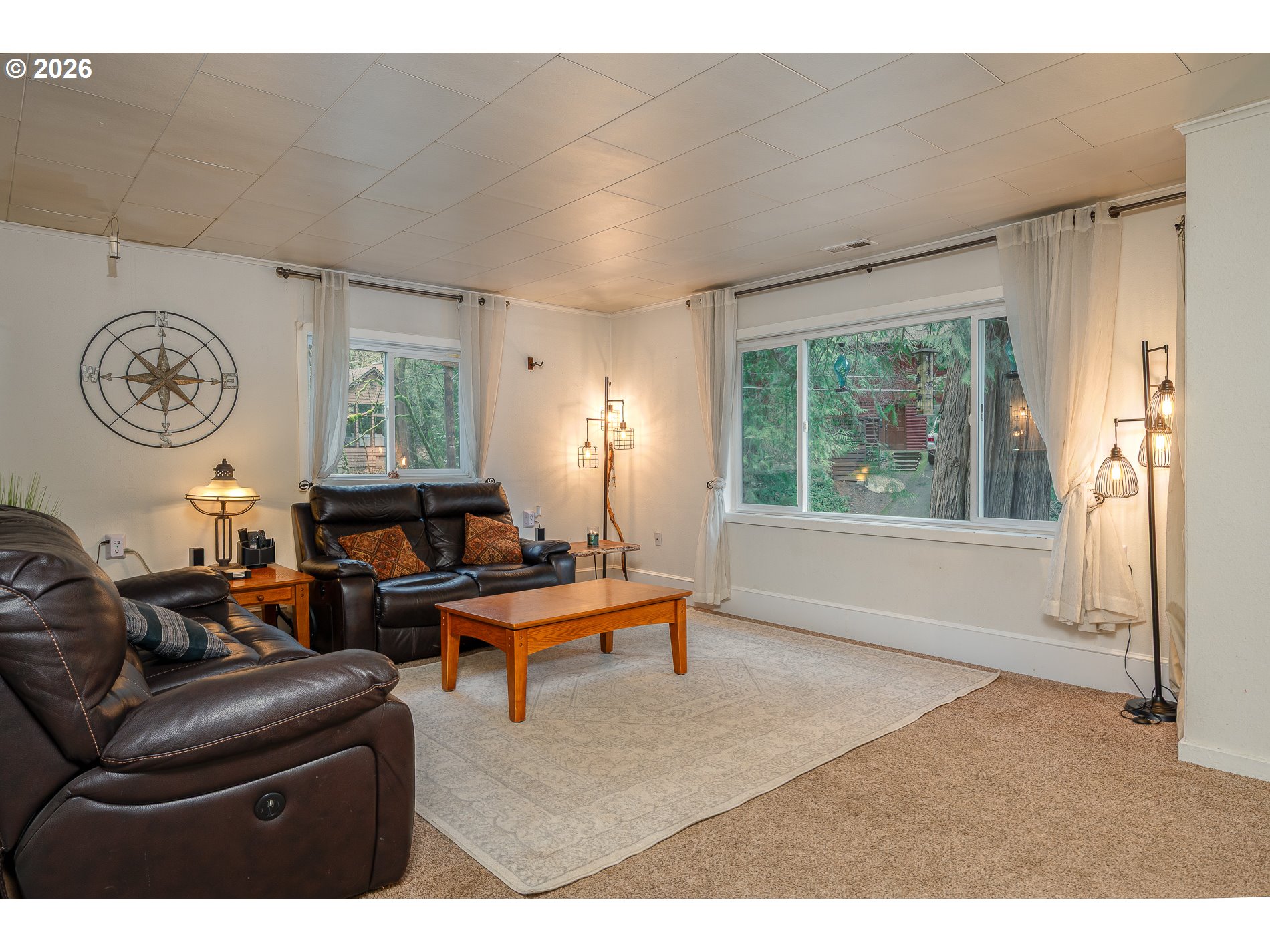 2685 Southwest 89th Avenue Portland, OR 97225 - Photo 9 of 37 a living room with furniture a window and a clock