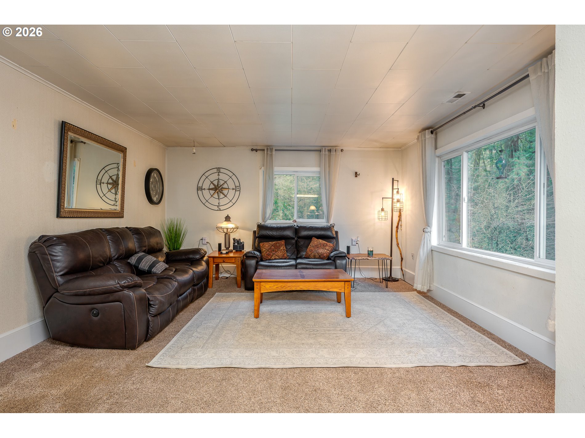 2685 Southwest 89th Avenue Portland, OR 97225 - Photo 10 of 37 a living room with furniture gym equipment and a large window