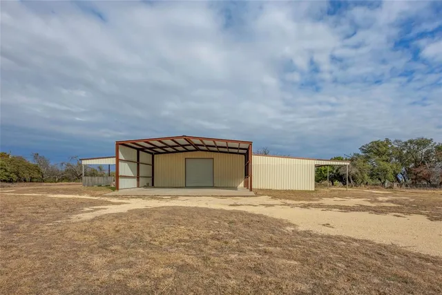 a view of a lake with a yard