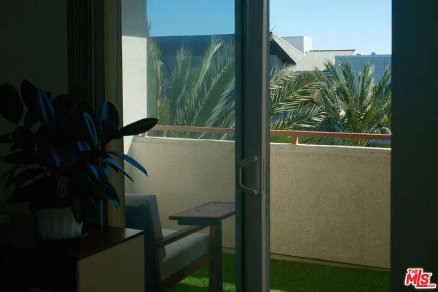 a view of balcony with a potted plant