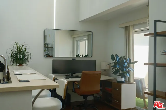 a view of a workspace with furniture