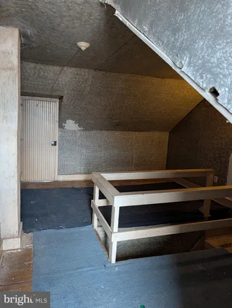 a utility room with wooden floor