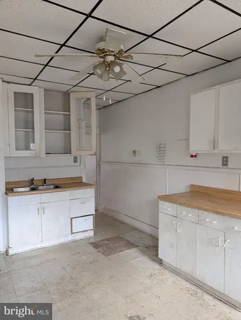 a kitchen with cabinets and appliances
