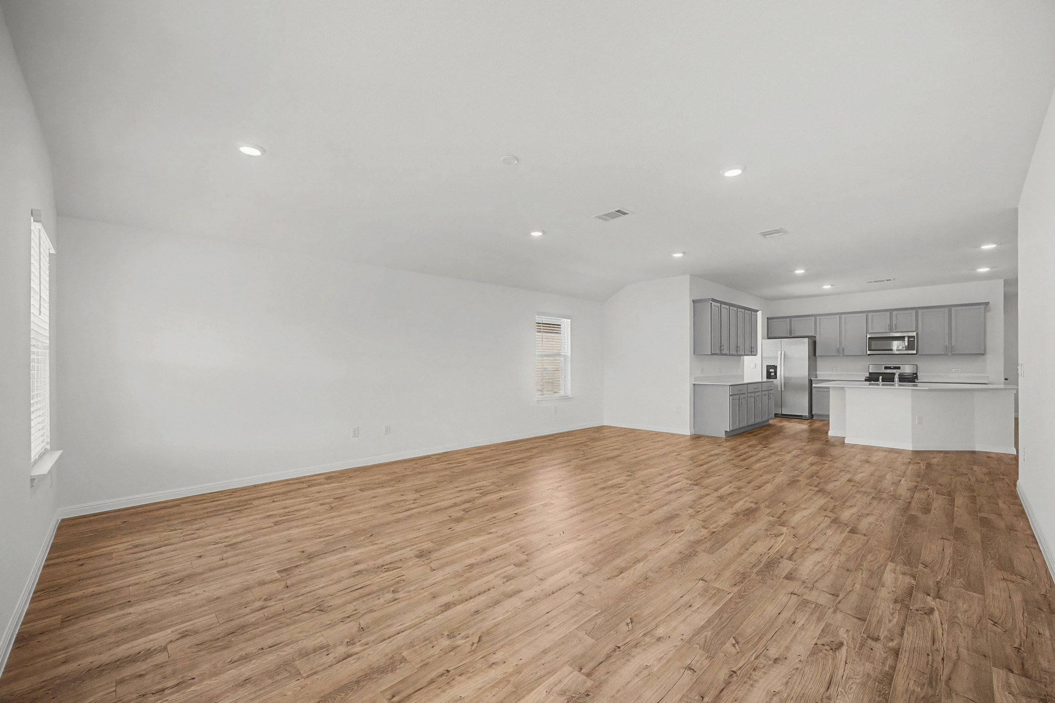1932 Bandito Bluff Pass Leander, TX 78641 - Photo 10 of 21 a view of a kitchen with a sink and wooden floor