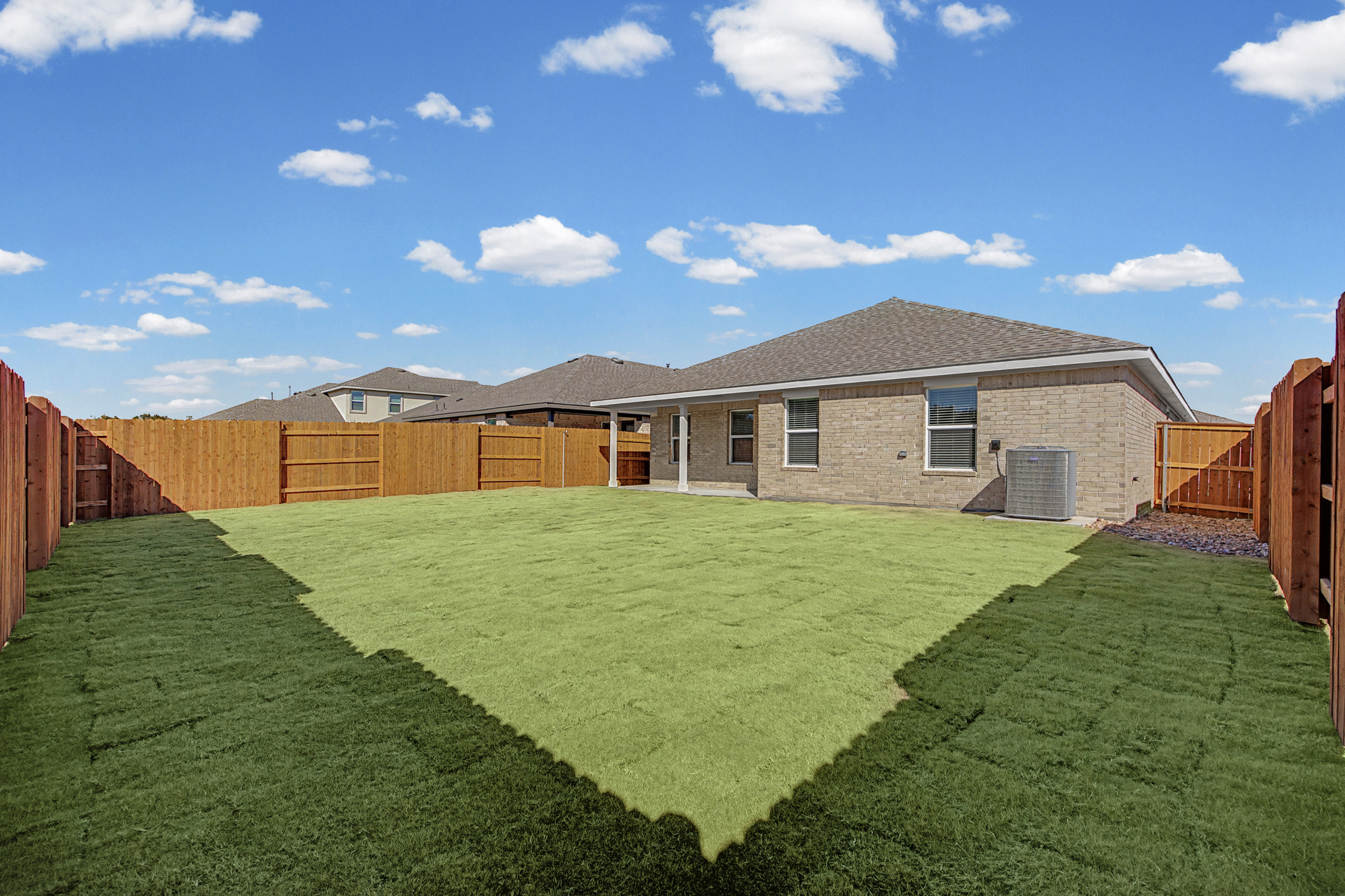 1932 Bandito Bluff Pass Leander, TX 78641 - Photo 20 of 21 a backyard of a house with table and chairs