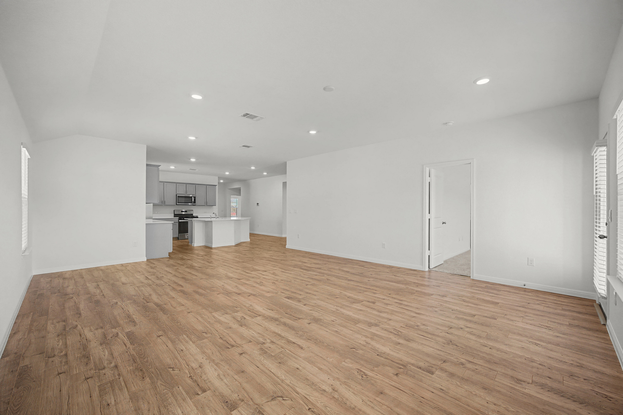 1932 Bandito Bluff Pass Leander, TX 78641 - Photo 9 of 21 a view of empty room with kitchen and window