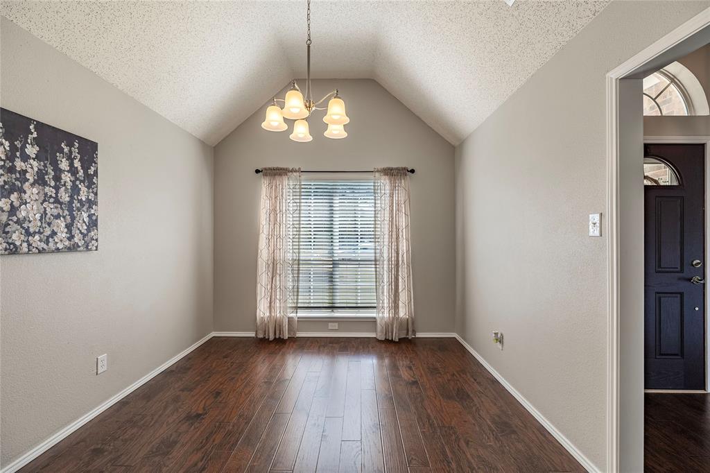 1805 Creek Crossing Garland, TX 75040 - Photo 12 of 39 wooden floor in an empty room with a window