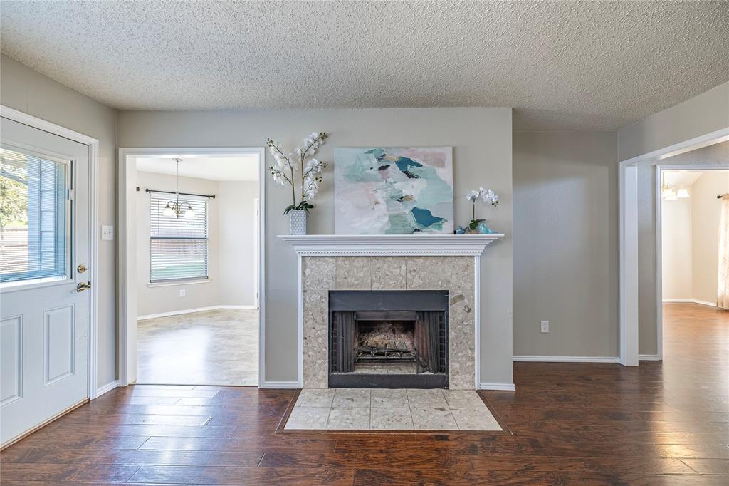 1805 Creek Crossing Garland, TX 75040 - Photo 21 of 39 a living room with furniture and a fireplace