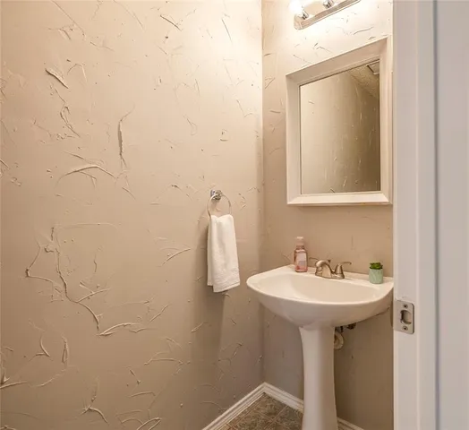 a bathroom with a sink and mirror