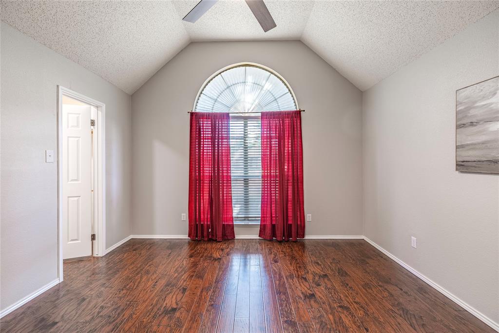 1805 Creek Crossing Garland, TX 75040 - Photo 25 of 39 an empty room with wooden floor and windows