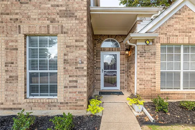a front view of a house with outdoor seating
