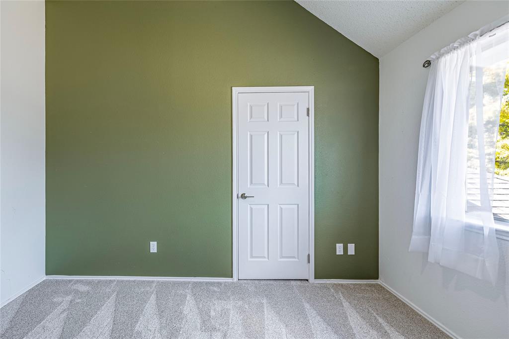 1805 Creek Crossing Garland, TX 75040 - Photo 32 of 39 an empty room with closet and windows