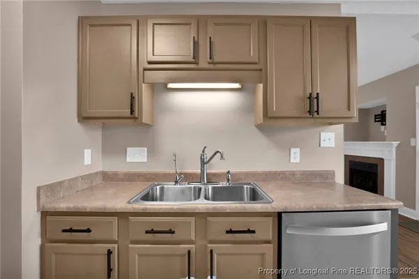 a kitchen with a sink and cabinets