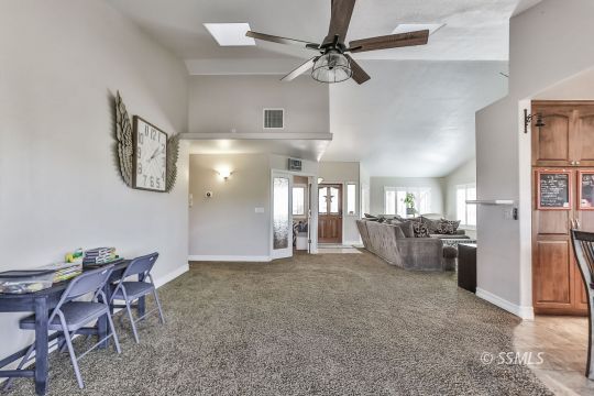 1220 Jennifer Court Ridgecrest, CA 93555 - Photo 14 of 34 a view of a livingroom with furniture and a ceiling fan