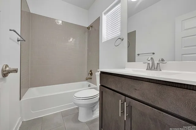 a bathroom with a sink a toilet and a bathtub