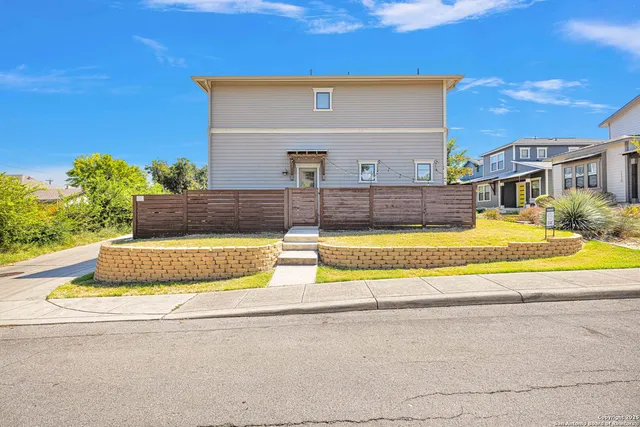a house view with swimming pool in front of it