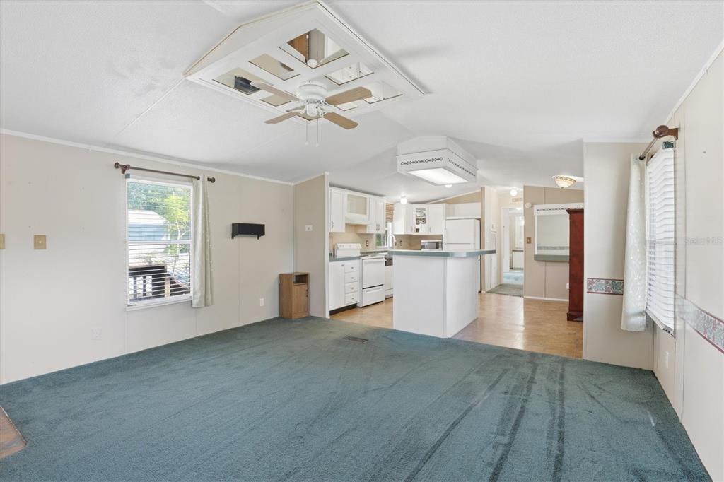 6169 Waverly Road Weeki Wachee, FL 34607 - Photo 28 of 51 a view of a big room with wooden floor and windows