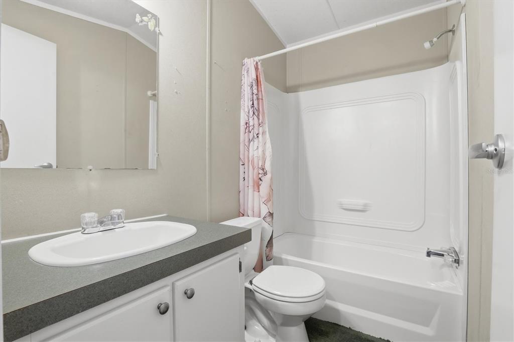 6169 Waverly Road Weeki Wachee, FL 34607 - Photo 44 of 51 a bathroom with a sink toilet and shower
