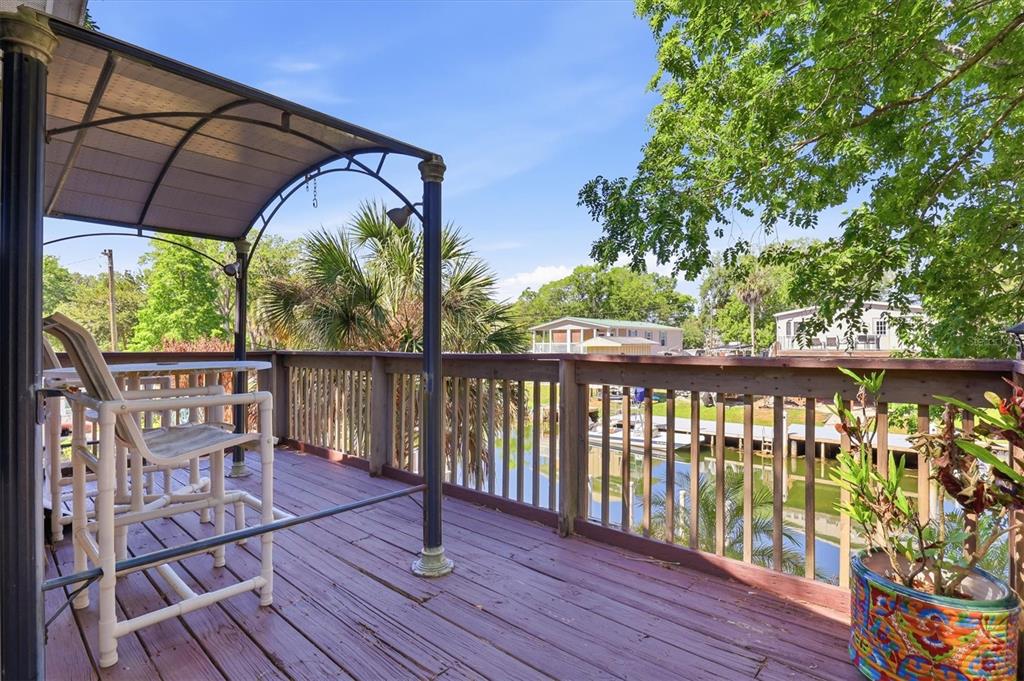 6169 Waverly Road Weeki Wachee, FL 34607 - Photo 45 of 51 a view of a two chairs on the roof deck
