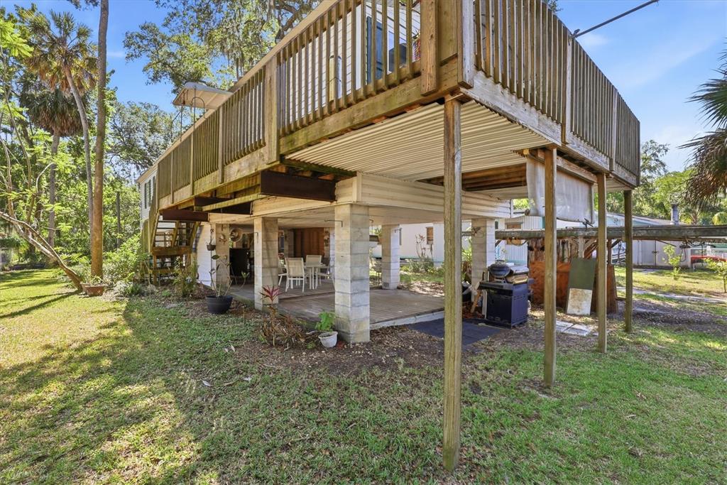 6169 Waverly Road Weeki Wachee, FL 34607 - Photo 50 of 51 a view of a house with a yard