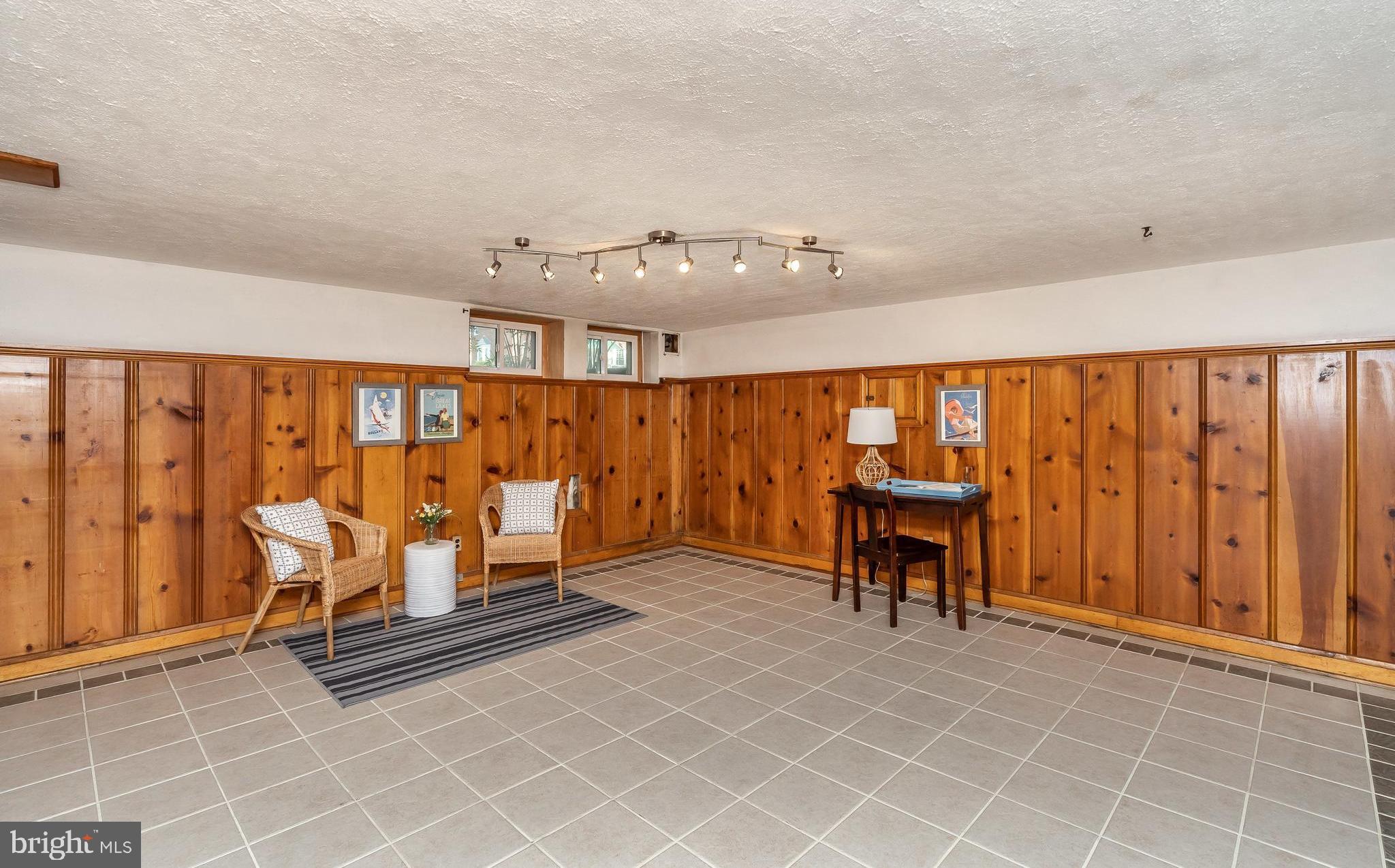 413 Stratford Road Baltimore, MD 21228 - Photo 26 of 42 Lower level Family Room with ceramic tile flooring