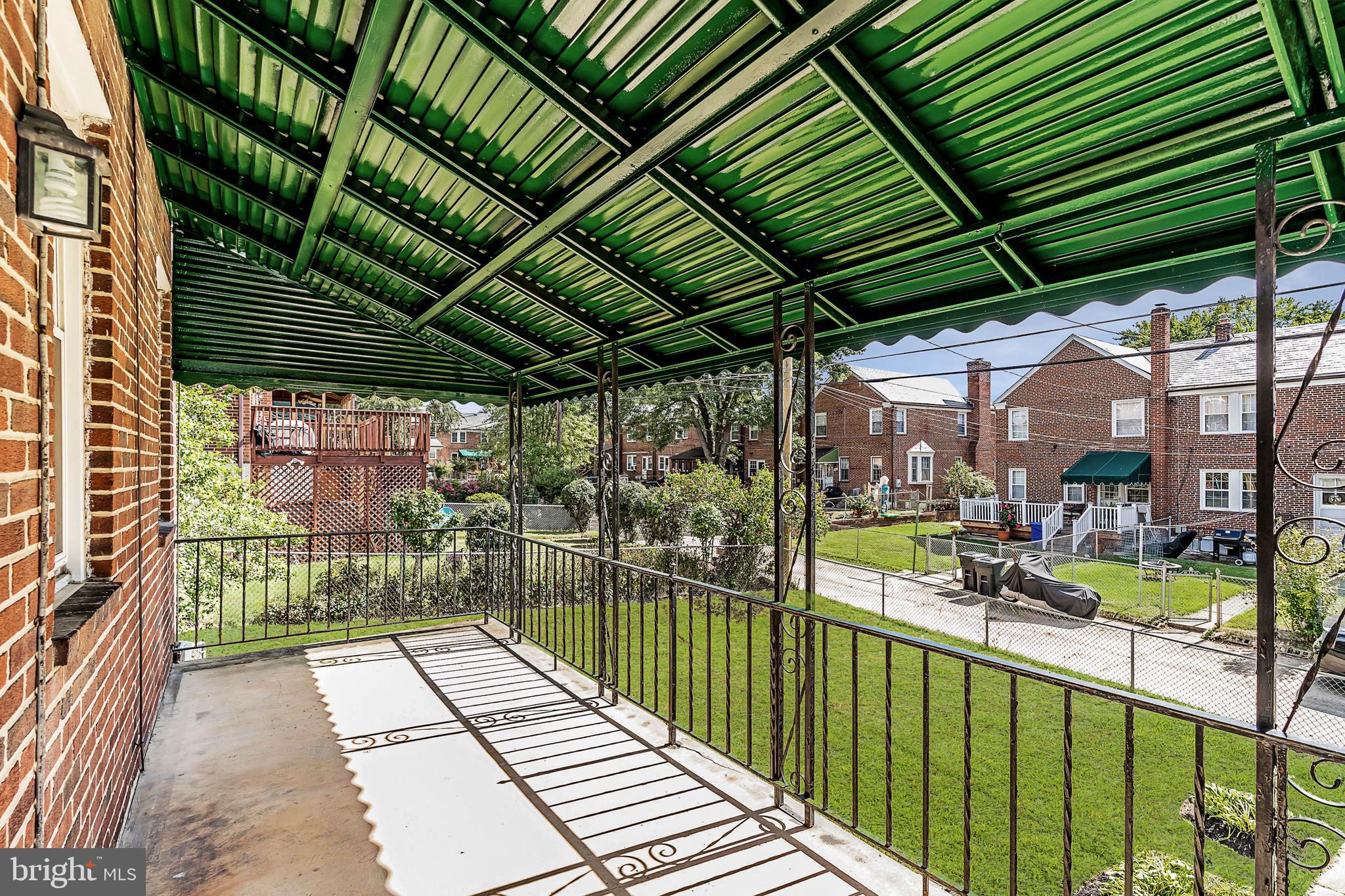 413 Stratford Road Baltimore, MD 21228 - Photo 32 of 42 Back porch overlooking fully fenced yard