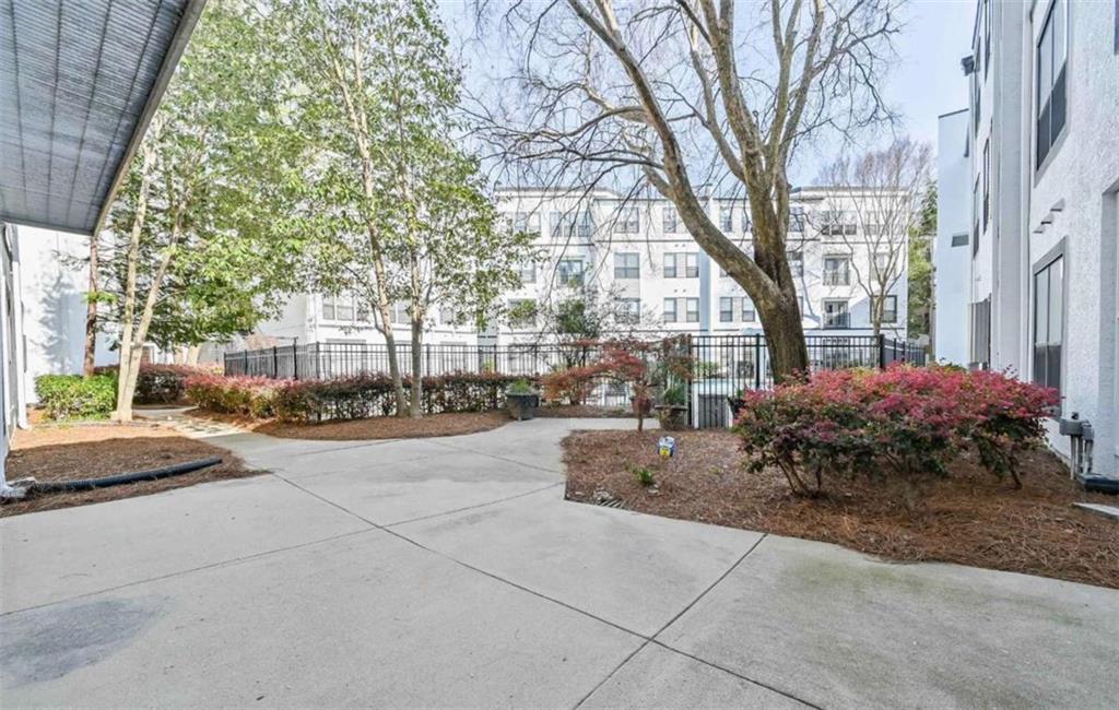 821 Ralph McGill Boulevard Northeast, Unit 2405 Atlanta, GA 30306 - Photo 1 of 12 a view of a building with a yard