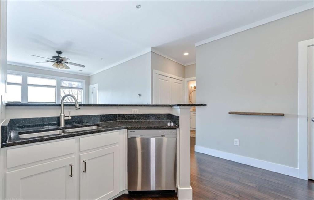 821 Ralph McGill Boulevard Northeast, Unit 2405 Atlanta, GA 30306 - Photo 5 of 12 a kitchen with a sink cabinets and wooden floor