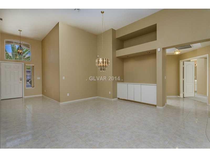 Property Photo. Foyer to formal dining room w/ built in buffet