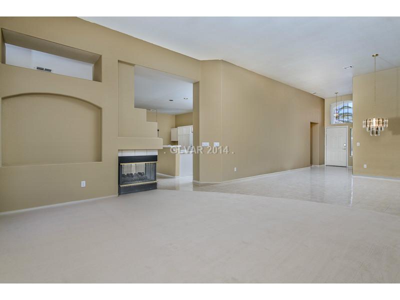 Property Photo. Formal living room w/ 3 way gas fireplace