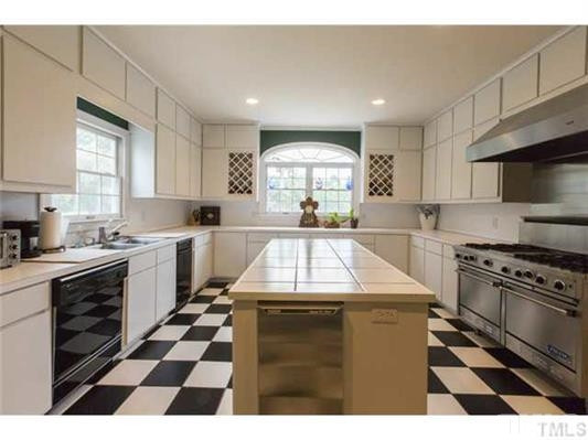 9123 South Lowell Road Bahama, NC 27503 - Photo 7 of 25 Renovated and created in 1990, this Kitchen is simply extraordinary for entertaining and whipping up tasty dishes for family and friends. Now THIS is a Kitchen