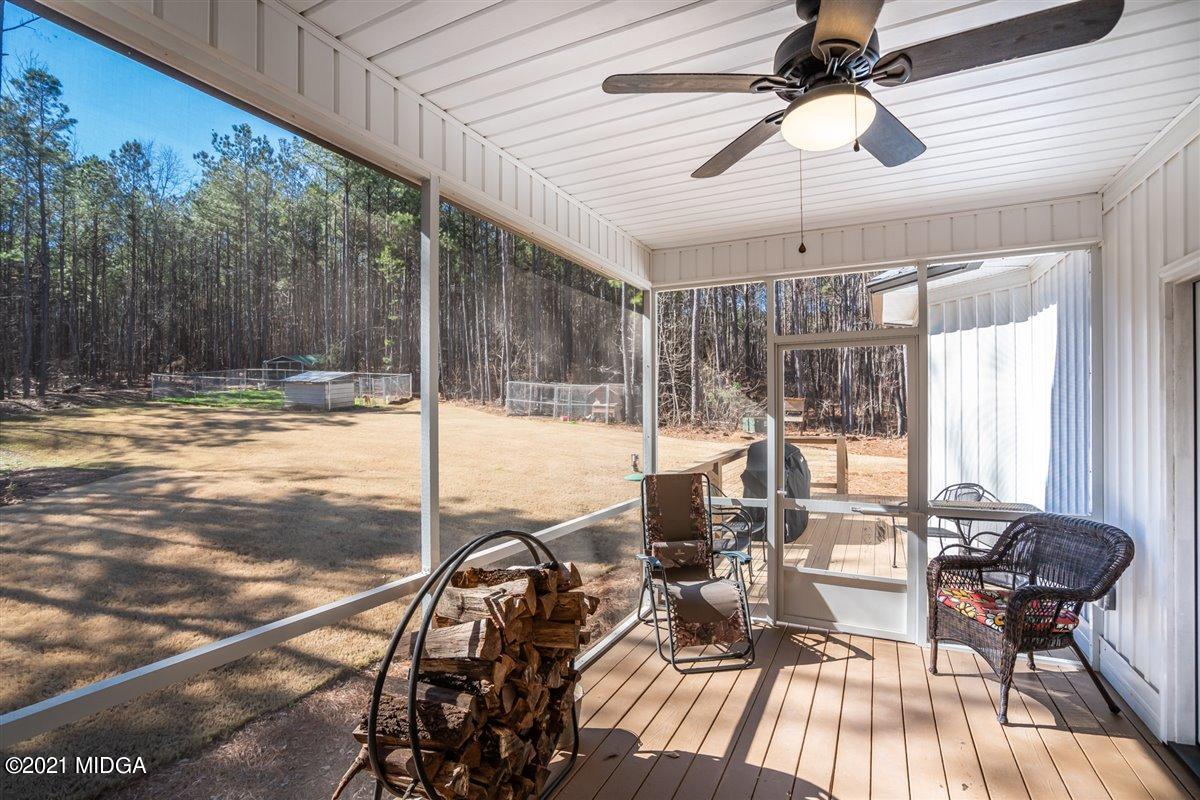 725 Taylor Road Juliette, GA 31046 - Photo 35 of 62 a view of a dining room with furniture wooden floor and chandelier