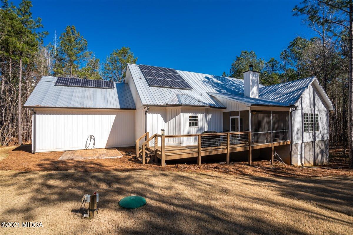725 Taylor Road Juliette, GA 31046 - Photo 39 of 62 a view of a house with a backyard and sitting area