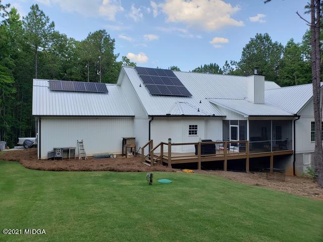 725 Taylor Road Juliette, GA 31046 - Photo 43 of 62 a view of a house with backyard and sitting area